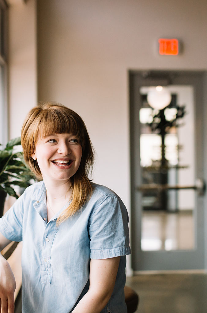 Smiling woman by a window_edited.jpg