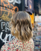 Person stood in front of shop