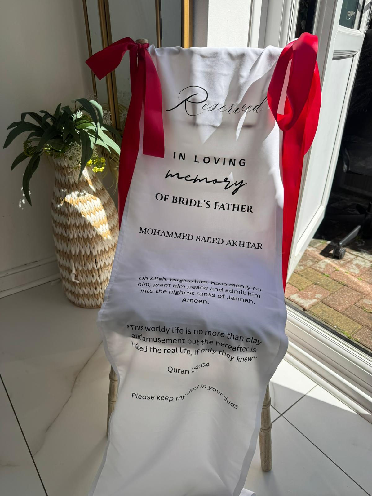 White Chair Fabric Banner With Burgundy Ribbon