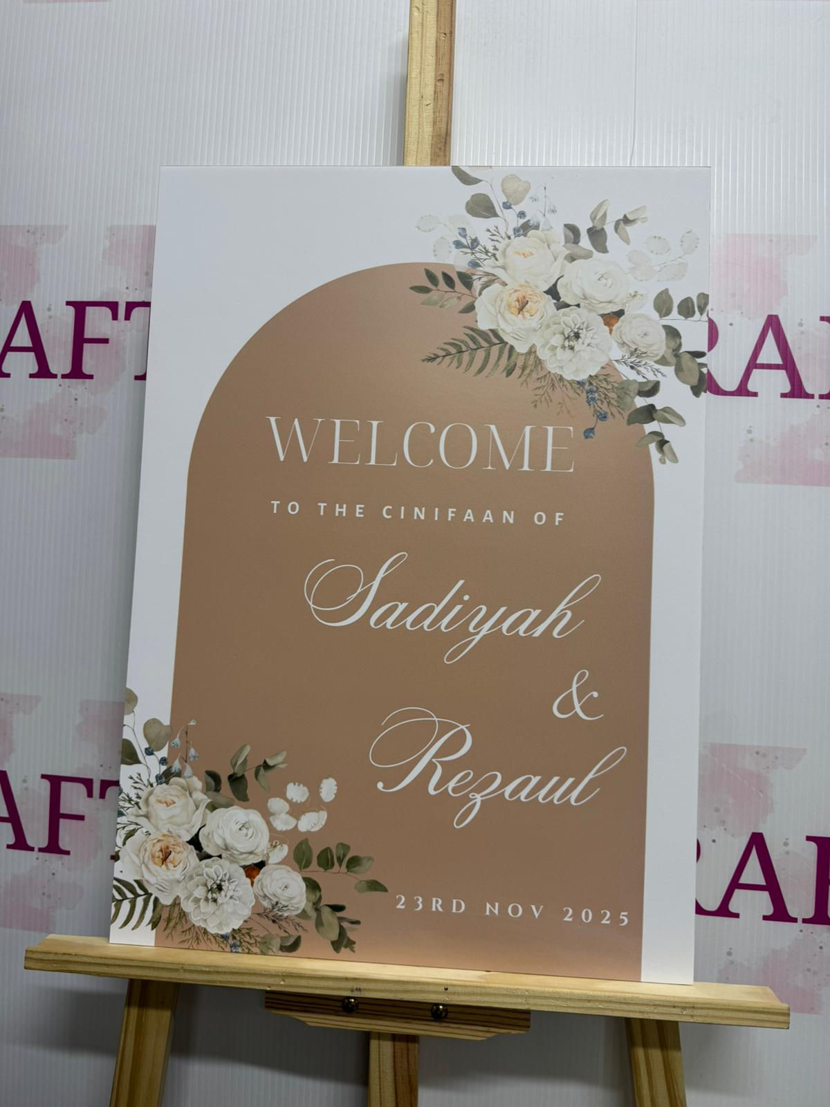 Brown Arch With White Flowers Engagement Welcome Board