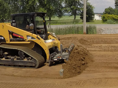 Grading is the process of leveling or reshaping the ground to create a smooth, even surface. This is typically done to prepare land for construction, landscaping, or to improve drainage.It can involve raising or lowering areas of land, removing rocks or debris, and adding fill dirt to achieve the desired slope and contour. Proper grading is crucial for the stability and longevity of any construction project.
