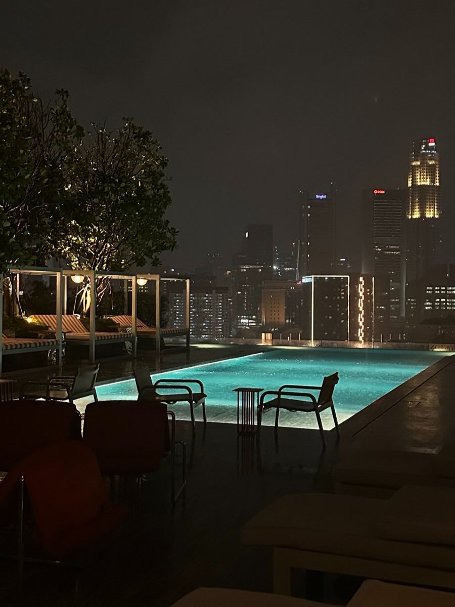 Poolside view on a rainy night at Mondrian Hotel, Singapore