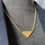 Thumbnail: REWORKED PRADA OCHER / GOLD NECKLACE