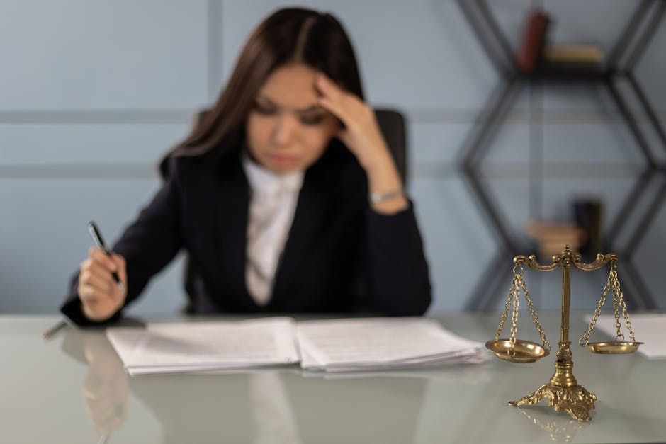 Lawyer reviewing documents with scales visible