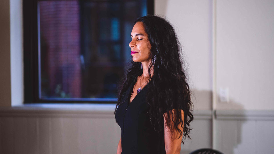 Profile of a woman with long hair from the “Negrura” documentary project.