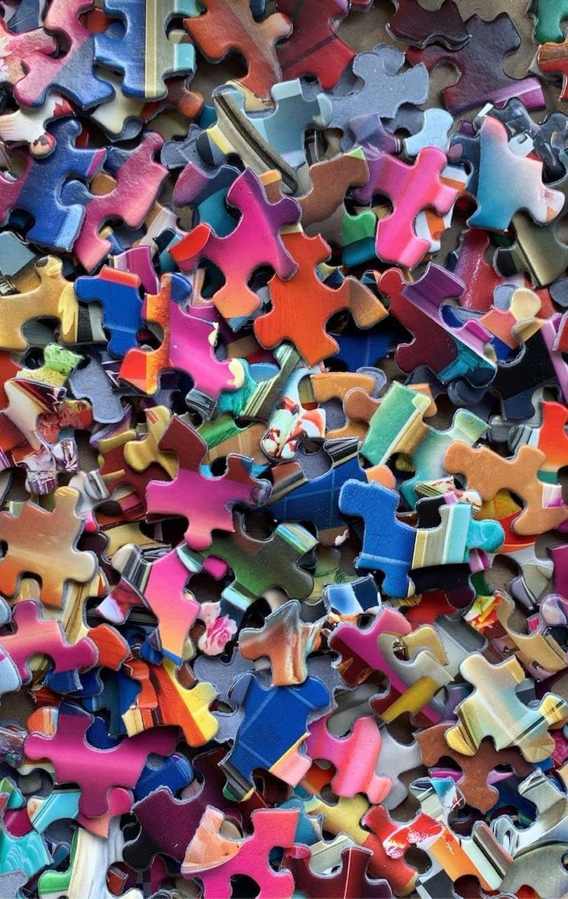 Thumbnail: Scattered colorful puzzle pieces