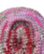 Thumbnail: Close-up of pink and red crocheted rug