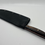 Thumbnail: Santoku Nitro V brass bolster, resin cast pine cone 