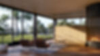 Modern living room with brown chairs, a table, and a lit fireplace. Large windows reveal green trees and grass.