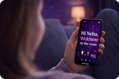 Hand holding phone with personalised welcome video showing dynamic customer name, representing Brand You Good's text personalisation service.