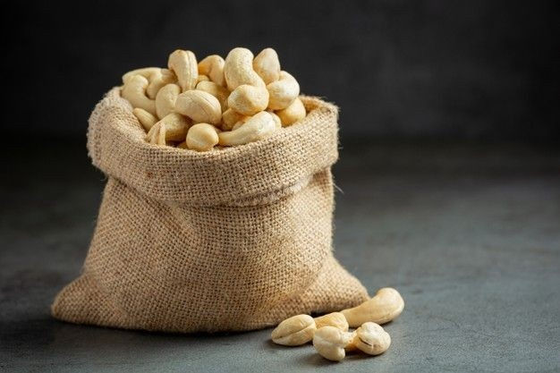 Raw Cashew Nuts in a bowl close-up view