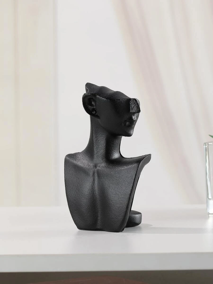 Statue noire en forme de buste