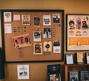 a corkboard at a coffee shop featuring band posters.jpg