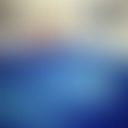 Glass muller sits on a glass slab of blue paint.