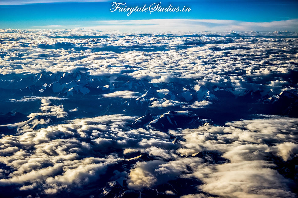 Snow clad grand Himalayas masked by scattered clouds (The Zanskar Odyssey)
