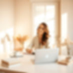A soft, sunlit workspace with a woman seated calmly at a clean desk._She’s surrounded by m