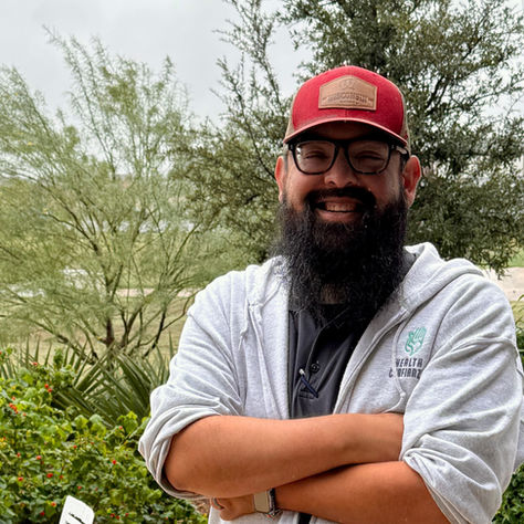 Santos posing for photo outdoors