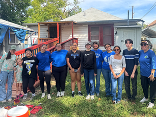 Our Lady of the Lake University student volunteers finished painting a wheelchair ramp