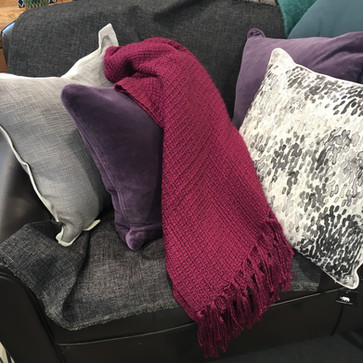 Beautiful texture and colour palette of cushions and throw