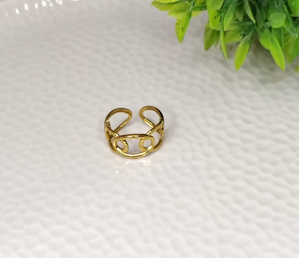 Gold Chain Band Ring 4 on white textured surface