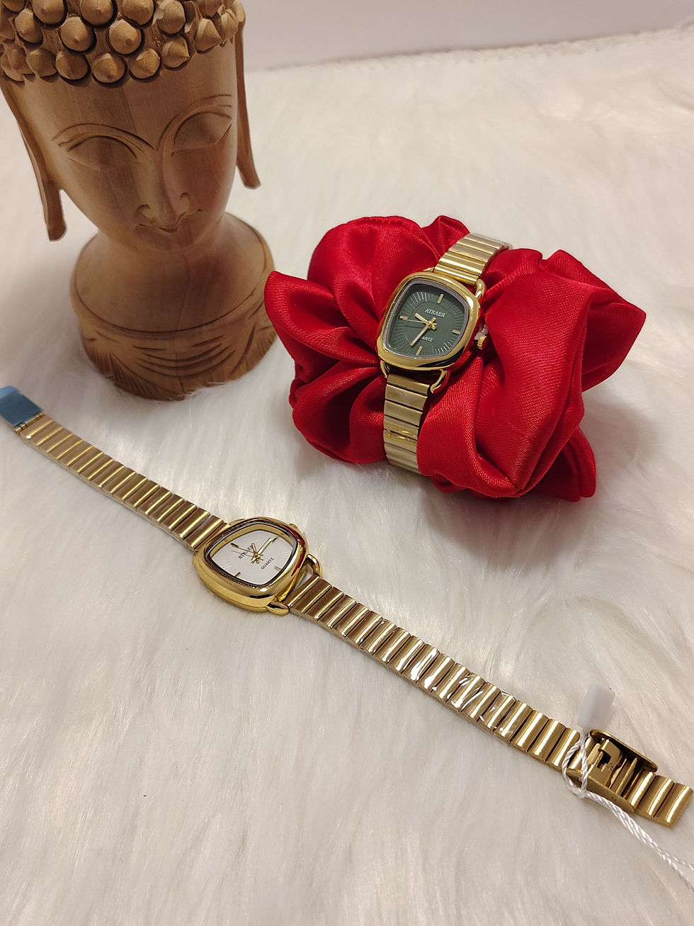 Two gold Quad Watch 2 timepieces with square faces