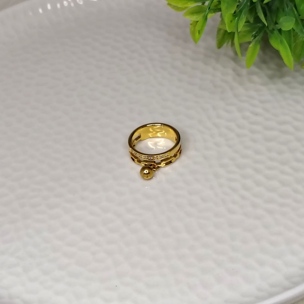 Thumbnail: Gold designer ring with a bead charm on a textured plate