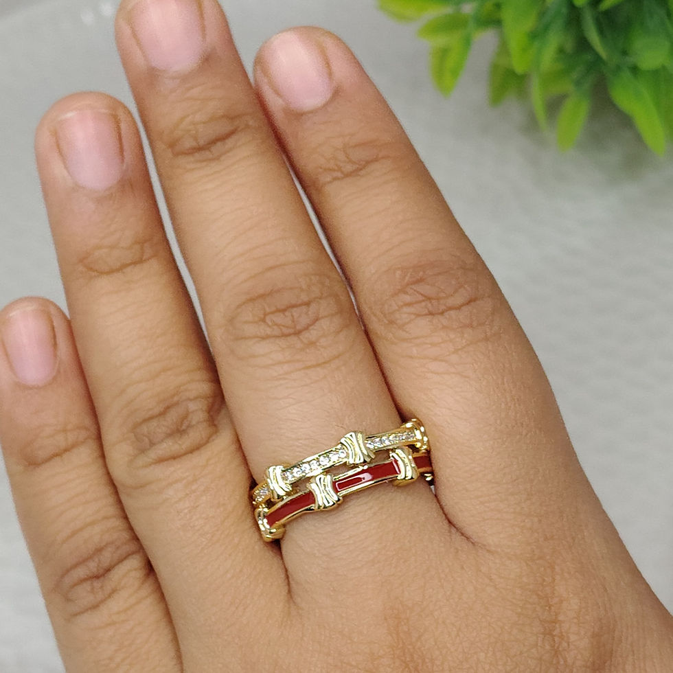 Thumbnail: Two row enamel ring with diamonds and red detail on a finger