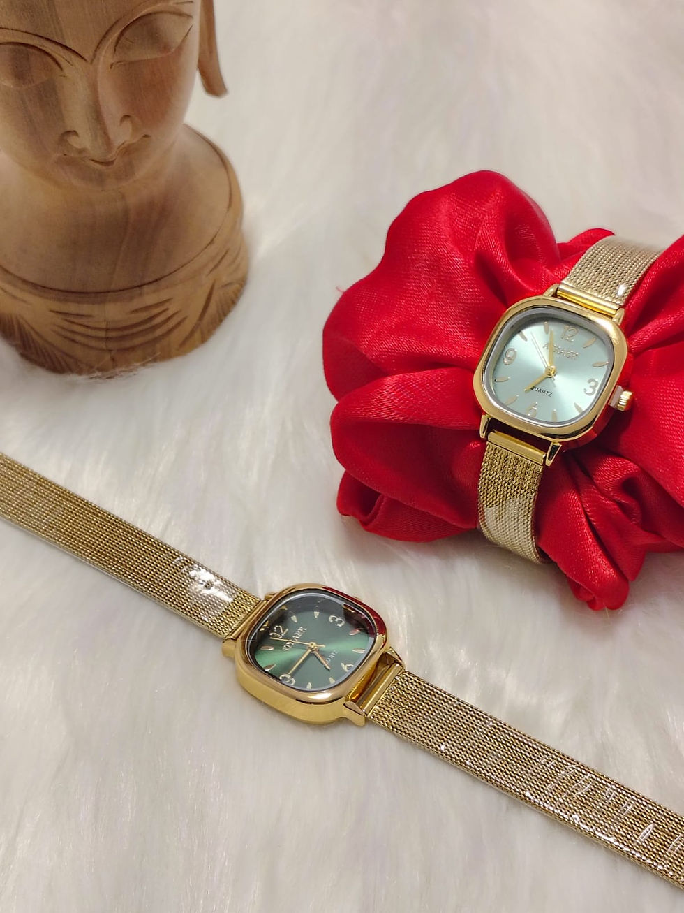 Gold square dial watch with green face and mesh strap