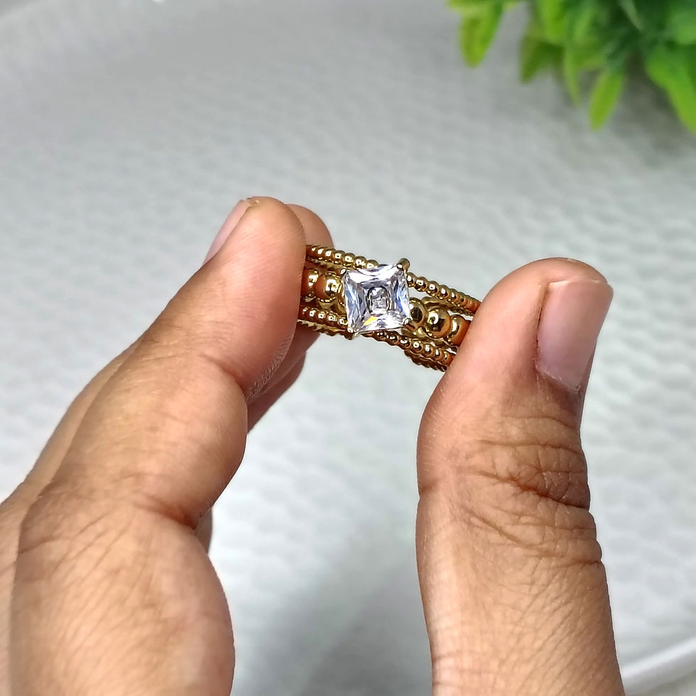 Thumbnail: Center Diamond 2 gold band held between fingers