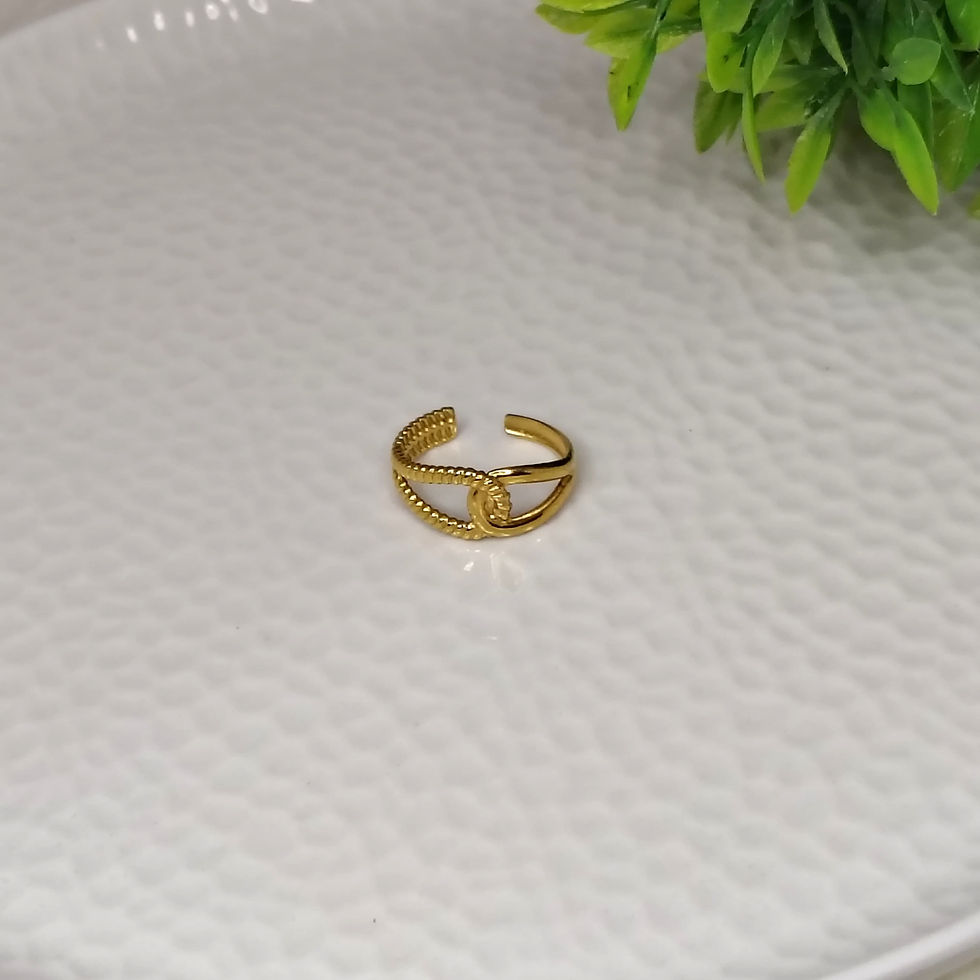 Gold chain band ring 5 on a white textured surface