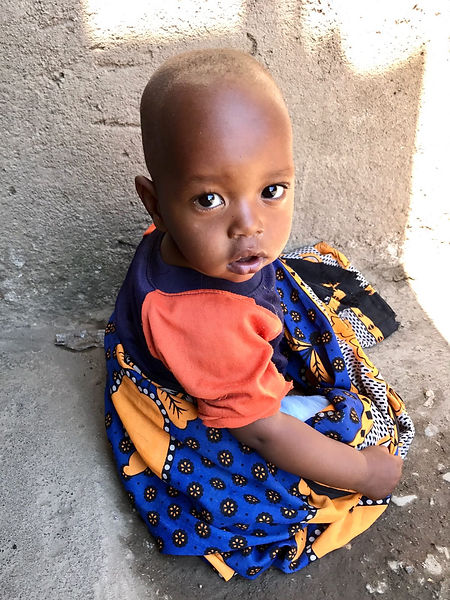 An adorable little Masai girl in her new