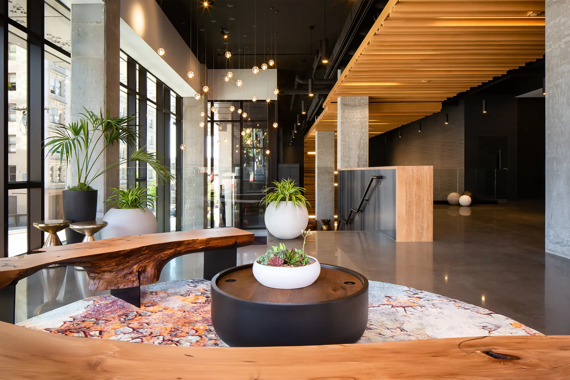 The Koda Condos lobby, complete with a 24-hour concierge, provides residents with a luxurious and secure entrance to their homes, offering personalized services and assistance for all of their needs.