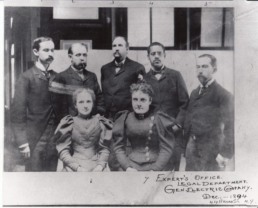 Lewis H. Latimer, second from right, with staff of the "experts' office," legal department, General Electric Company.