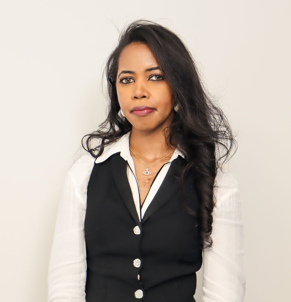 A young ethnic minority woman in business attire looks at the camera