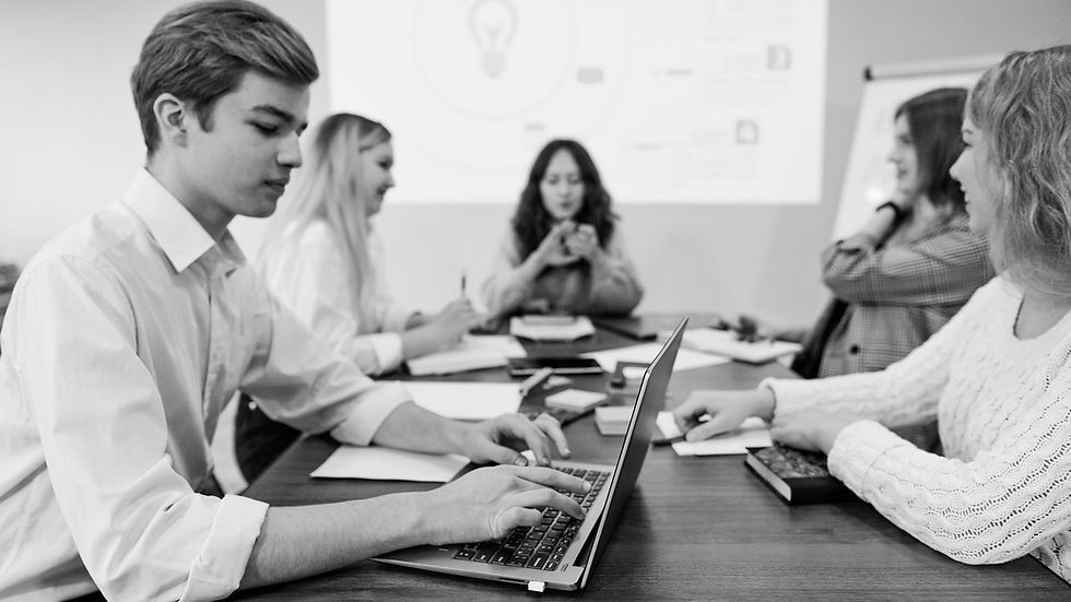 Business team engaged in a meeting, illustrating teamwork and collaboration in an office environment.