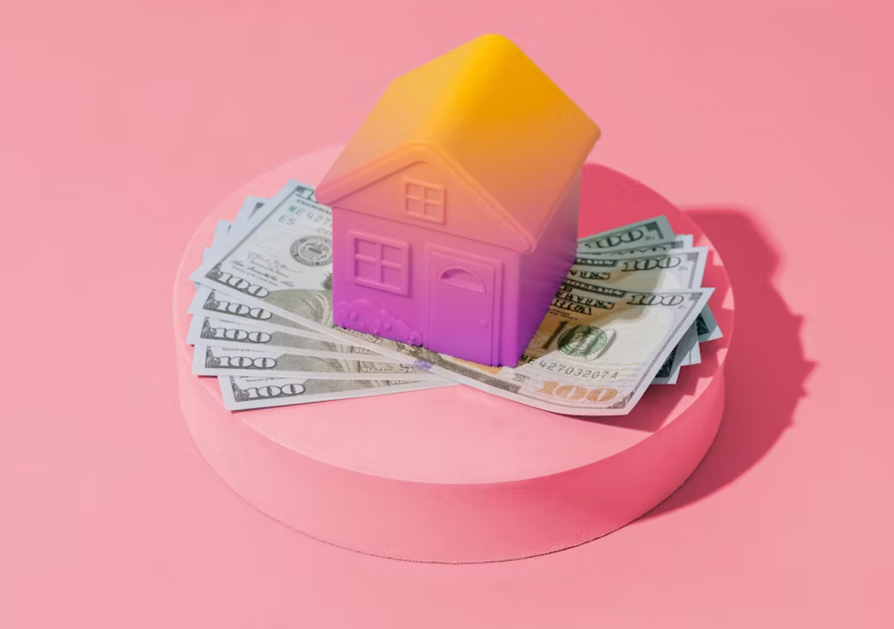 Toy house on dollar bills atop a pink platform, set against a pink background. The house is vibrant with a yellow to purple gradient.