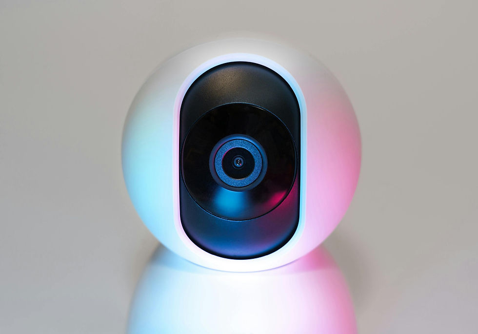 White surveillance camera on a smooth background, illuminated with blue and pink lights, creating a sleek, modern aesthetic. No visible text.