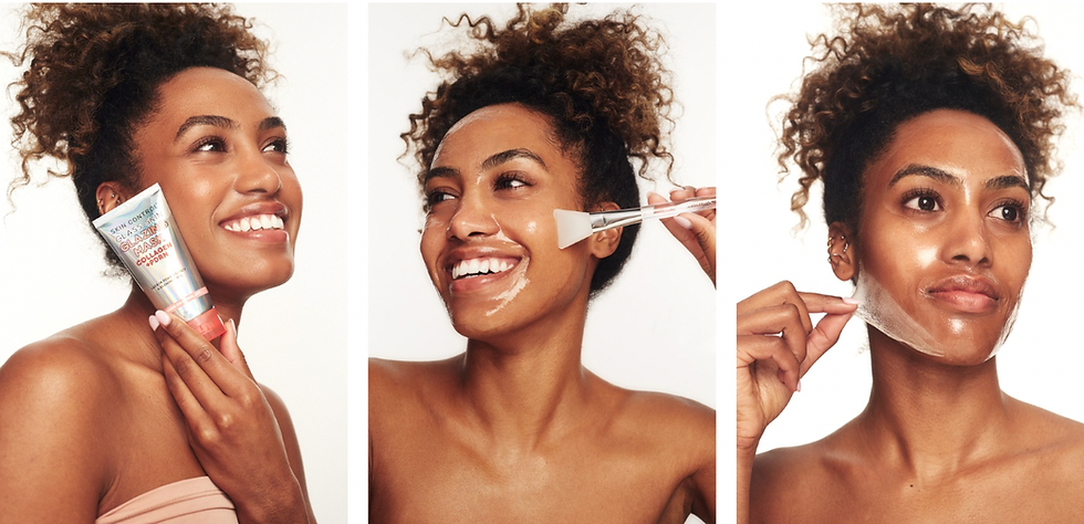 Woman smiling while applying shimmering face mask using applicator. She holds a colorful tube labeled “Galaxy Peel-Off Mask.” White background.