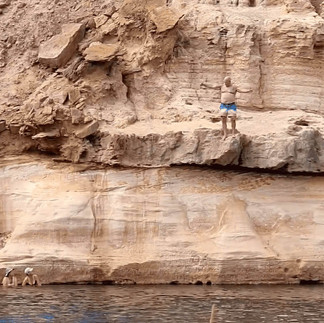 Person perched on rock above Ellendale Pool
