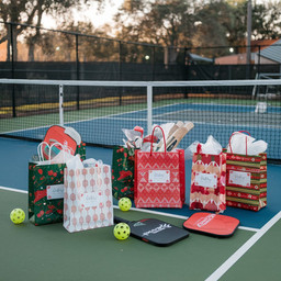 christmas gifts displayed on a pickleball court