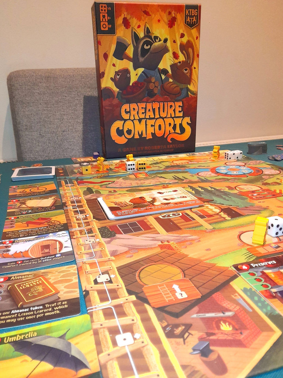 Creature Comforts game box and board mid game showing the gameboard, dice and cards