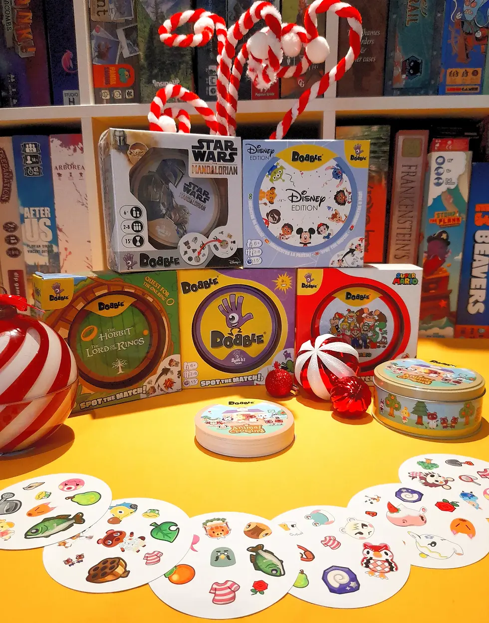 Board games on a shelf, including Star Wars and Disney editions, with striped candy canes and holiday decorations on a yellow backdrop.