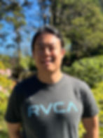 Portrait of Jimmy Chang in a blue t-shirt in the sun