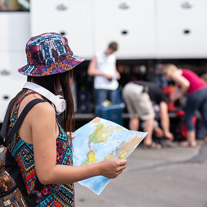 woman-holding-map-train-station-tourism-concept_edited.jpg