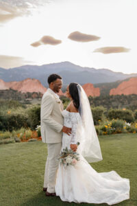 Bride and groom portrait, the couple holding each other and looking into each others eyes.