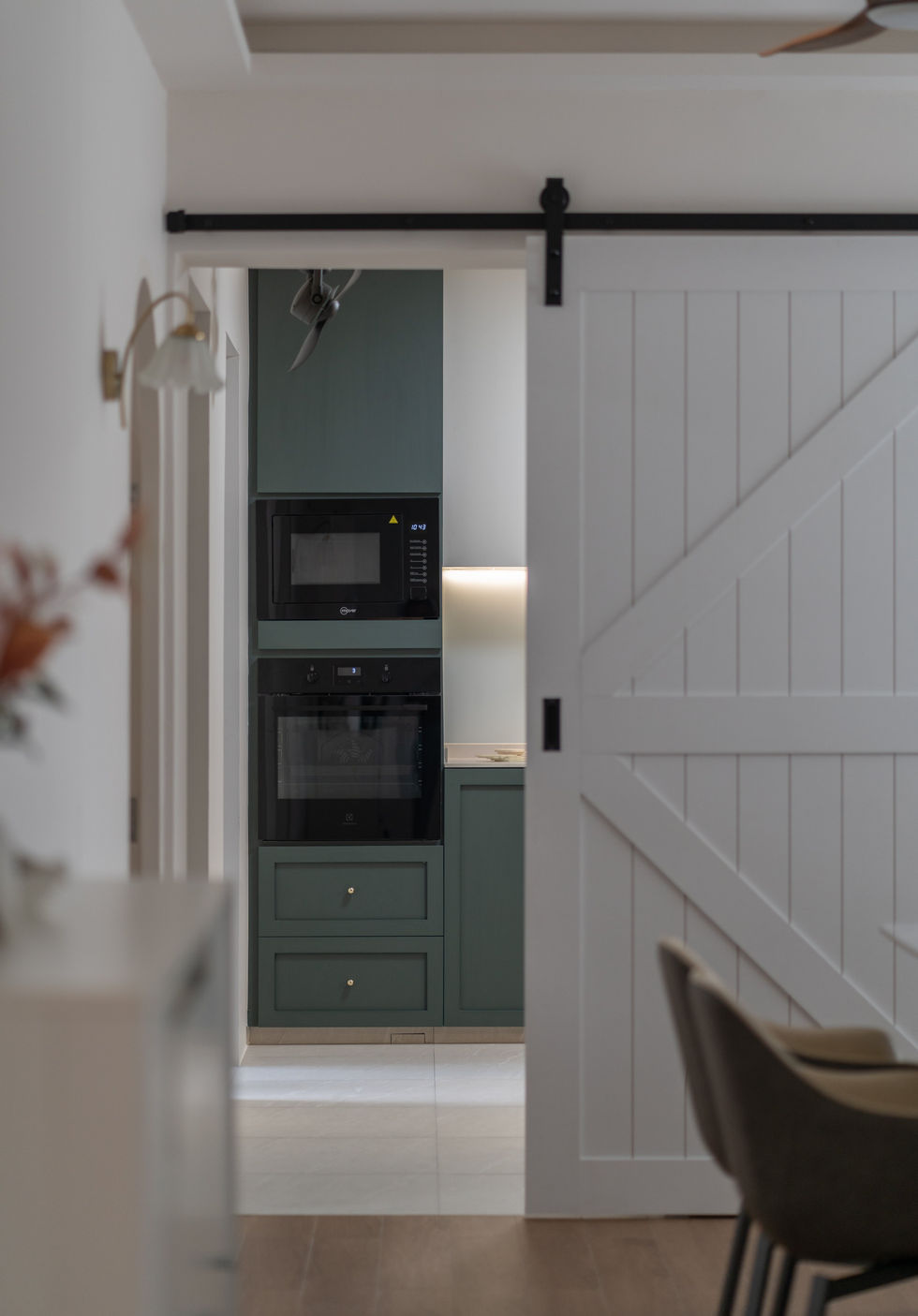 Modern HDB kitchen renovation with barn door