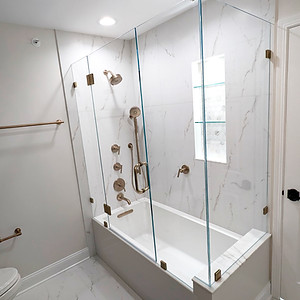 Finished bathroom remodel featuring custom tilework, modern fixtures, and updated finishes.
