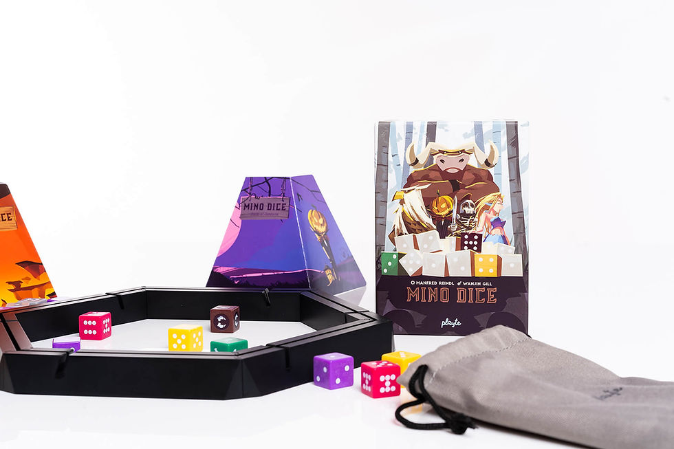 The Game Rack with several dice and screens to the left, with the Mino Dice box and dice bag on the right.