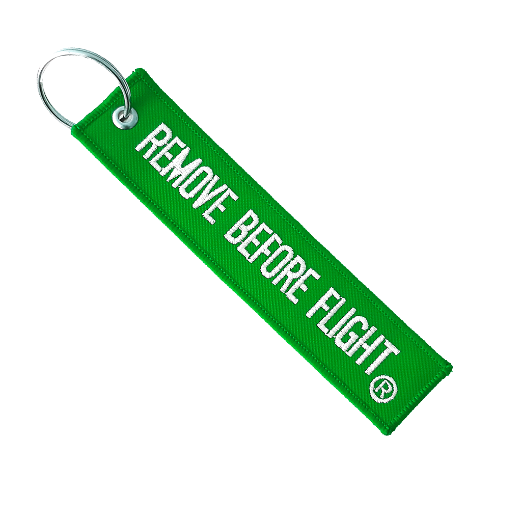 Llavero Remove Before Flight Color verde /blanco