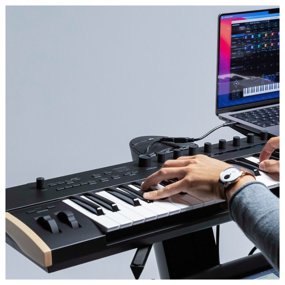 Image of Korg Keystage 49 Polytouch MIDI Keyboard being played with laptop
